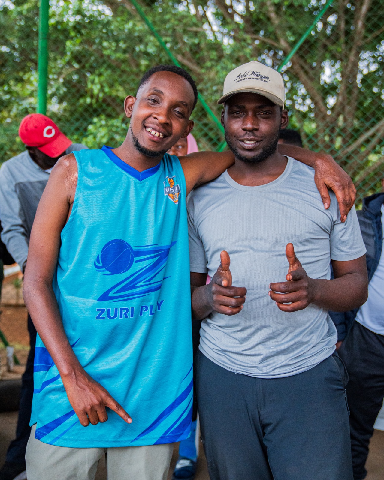 Two Umoja supporters smiling together ahead of game day