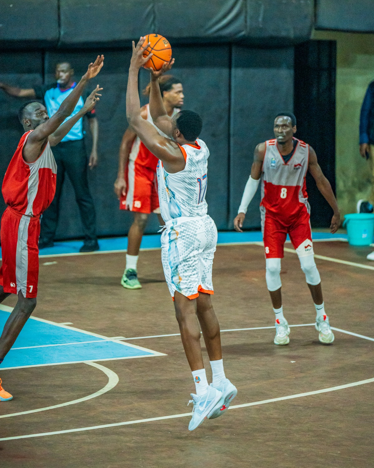 Umoja player taking a jump shot during last year's playoff meeting with Equity