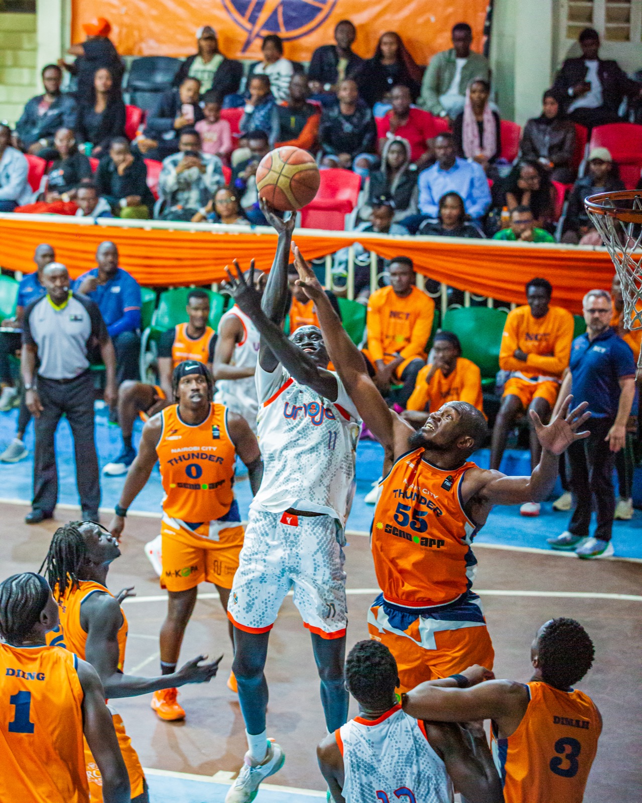 Umoja player attacking the basket through traffic