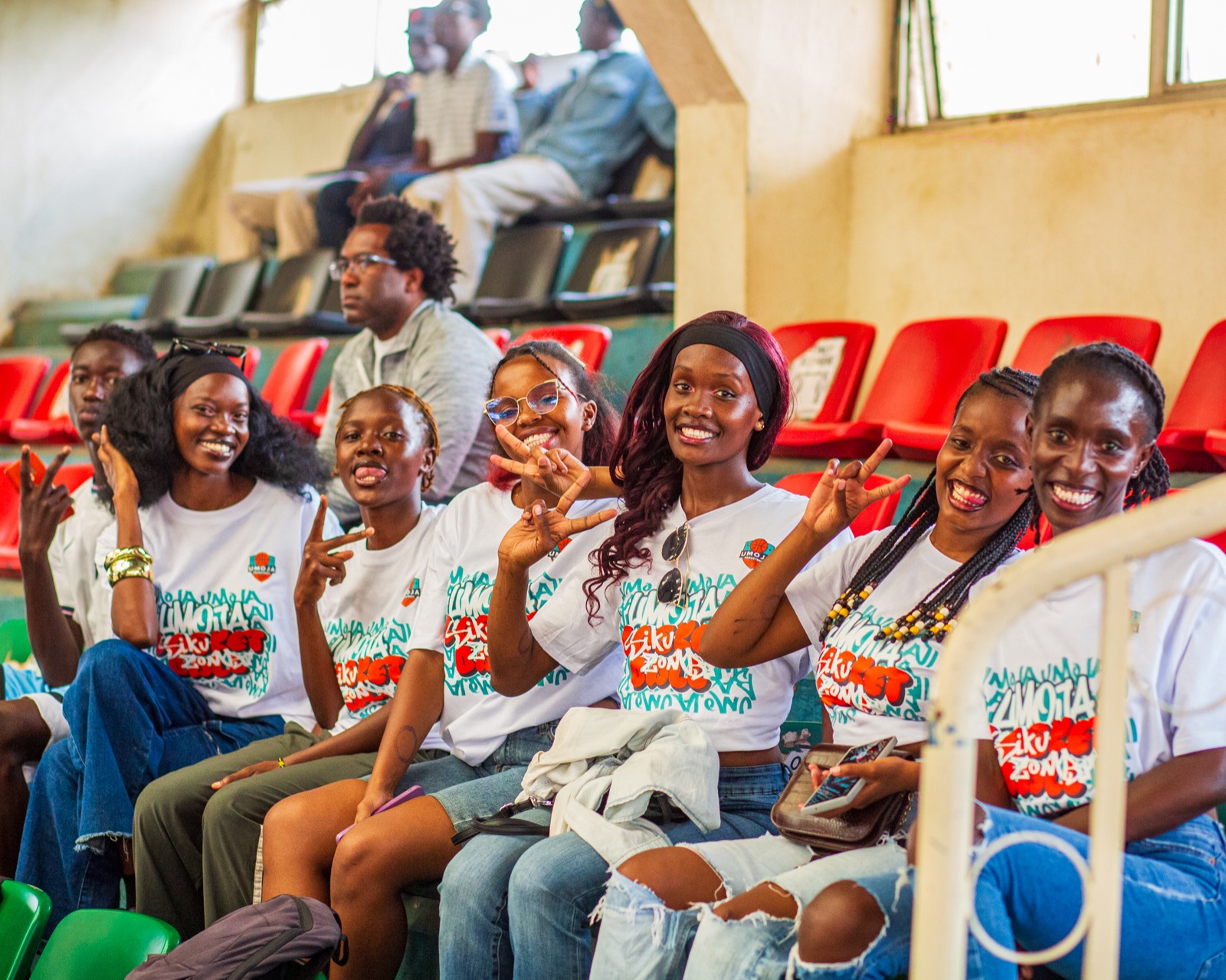 Umoja supporters smiling in the stands during the playoff series